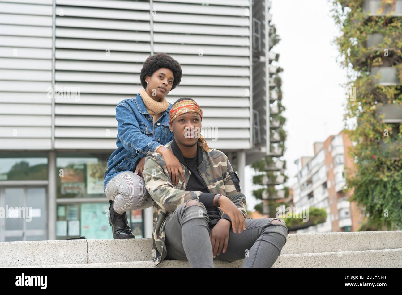 African wedding couple sitting on the stairs Stock Photo
