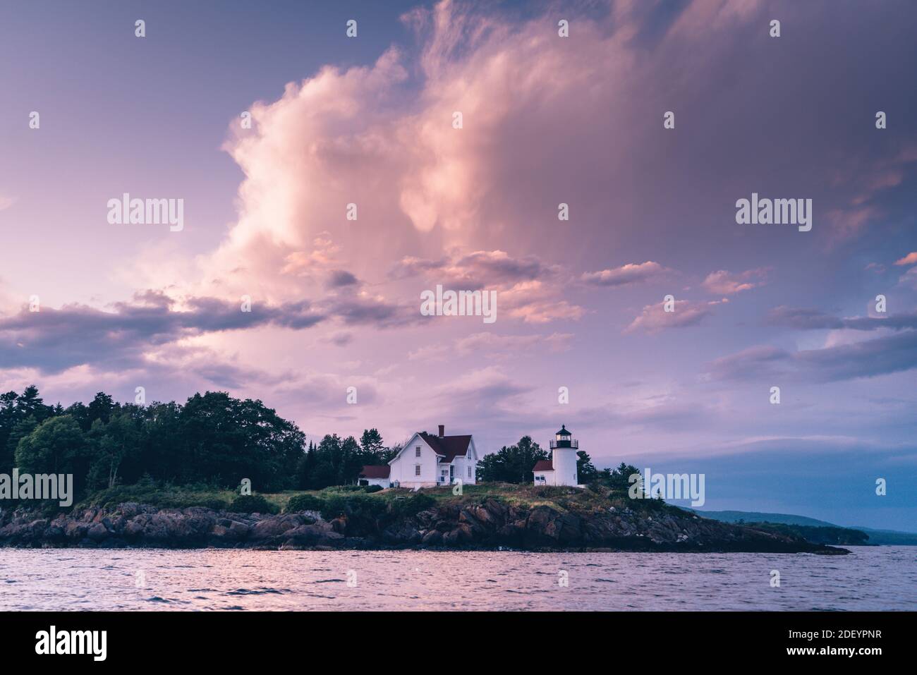 Curtis Island lighthouse off the coast of Camden, Maine at sunset Stock Photo