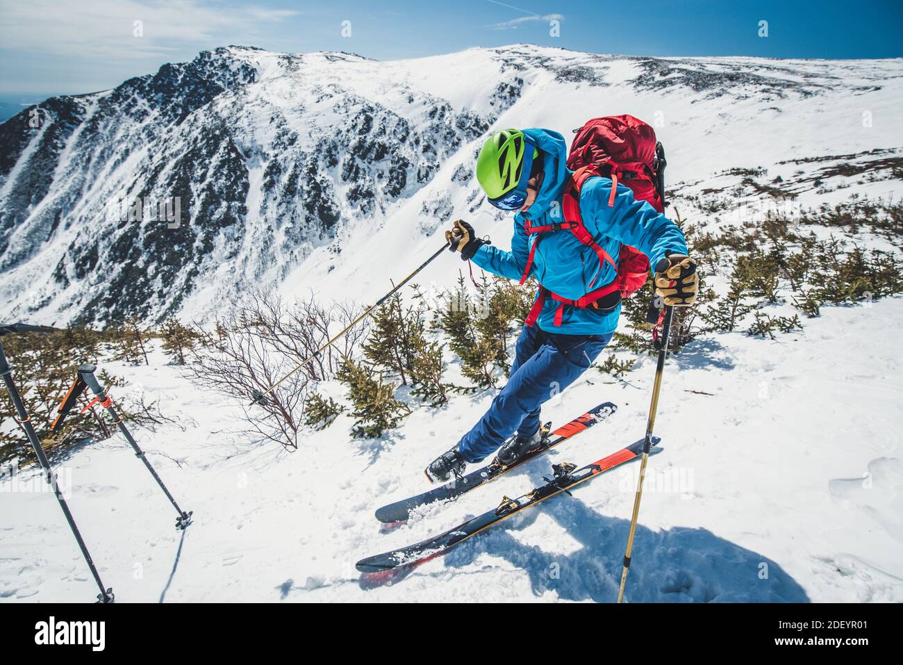 Backcountry skier clipping in above Tuckerman Ravine, NH Stock Photo