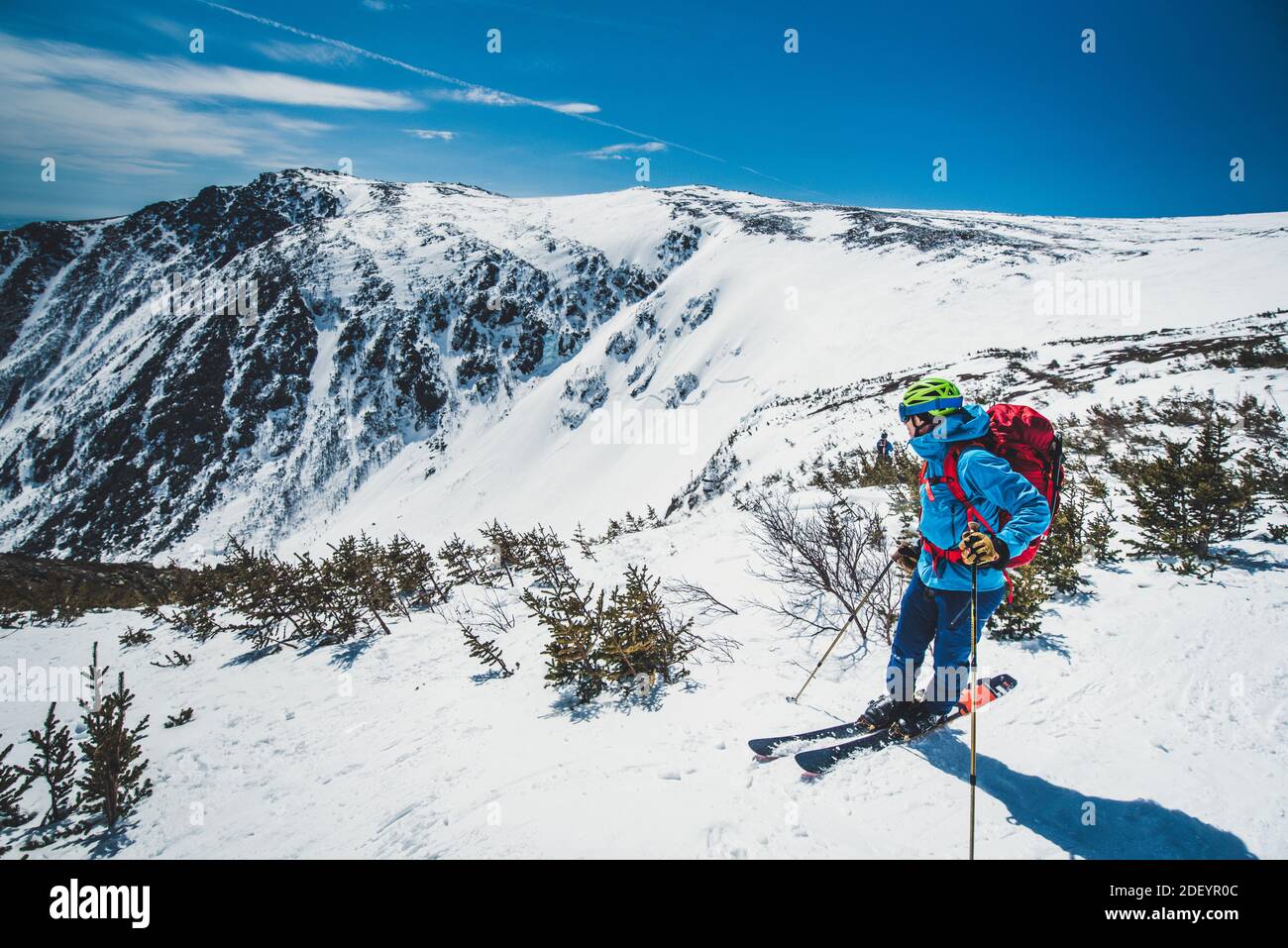 Man skier standing atop Tuckerman Ravine in New Hampshire Stock Photo