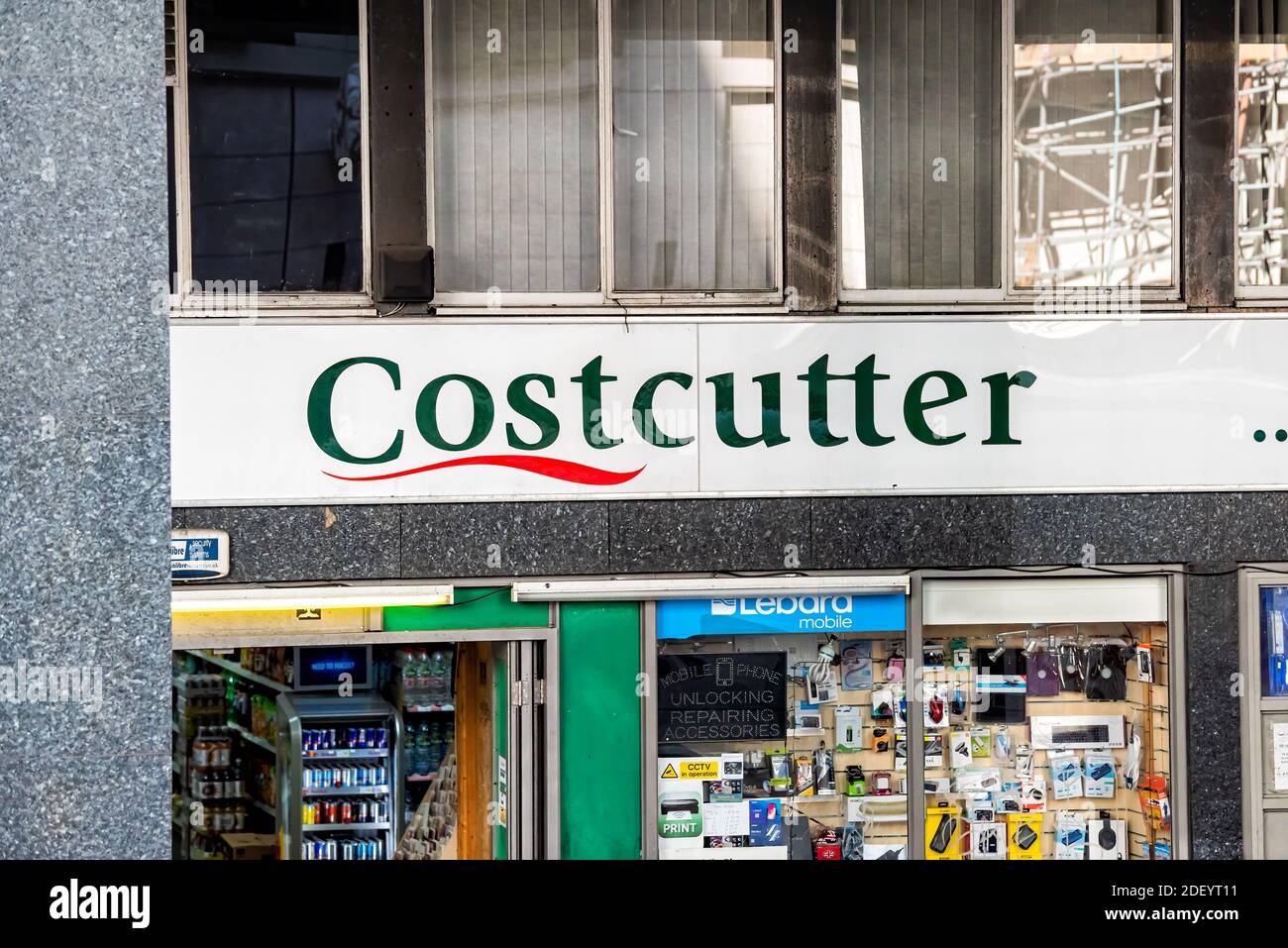 London, UK - June 22, 2018: Neighborhood local store Costcutter grocery shopping storefront facade exterior entrance with sign and entrance Stock Photo
