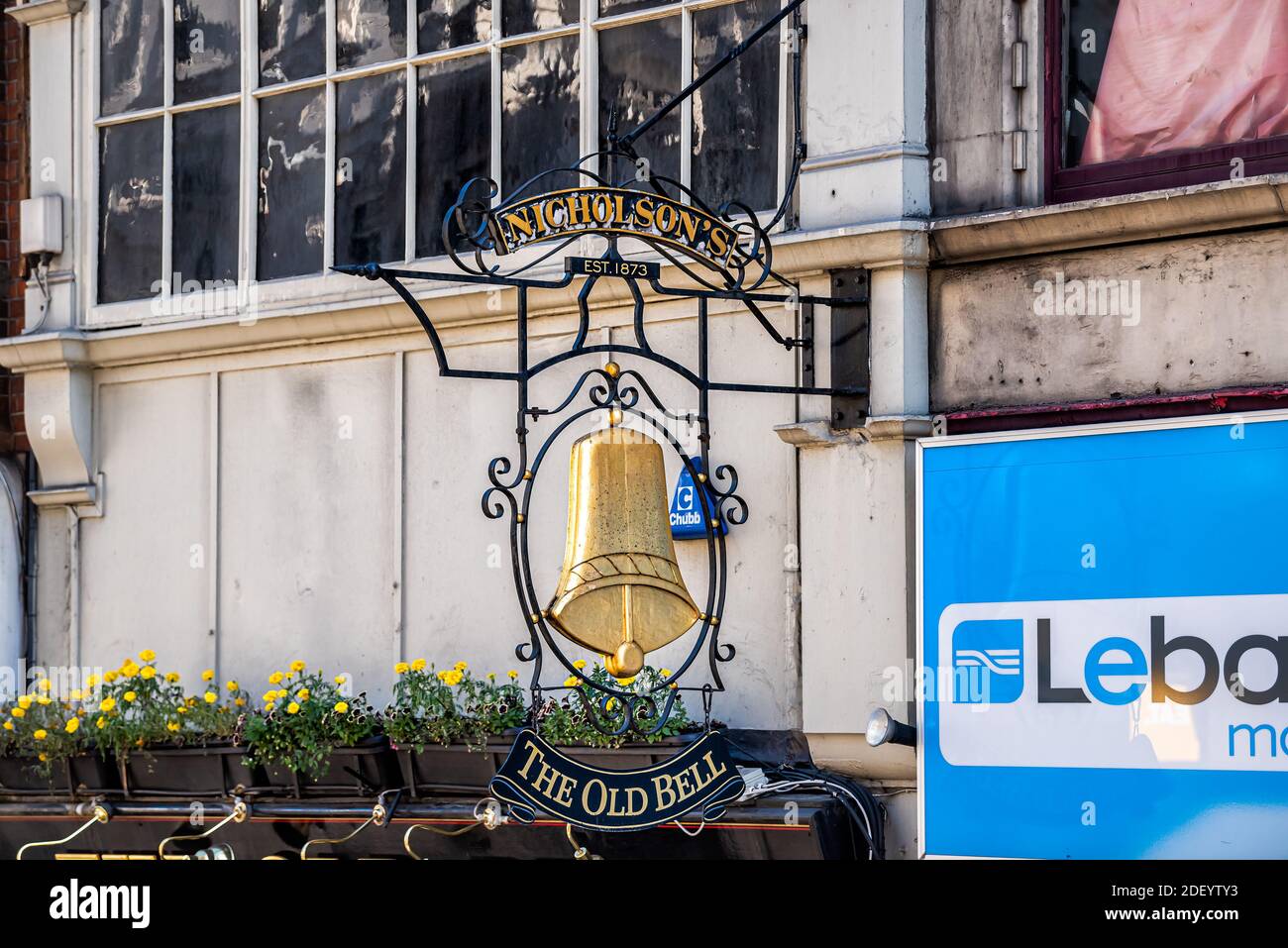London, UK - June 22, 2018: Closeup of famous The old bell tavern pub bar entrance sign and nobody with gold symbol and Nicholson's text with date Stock Photo