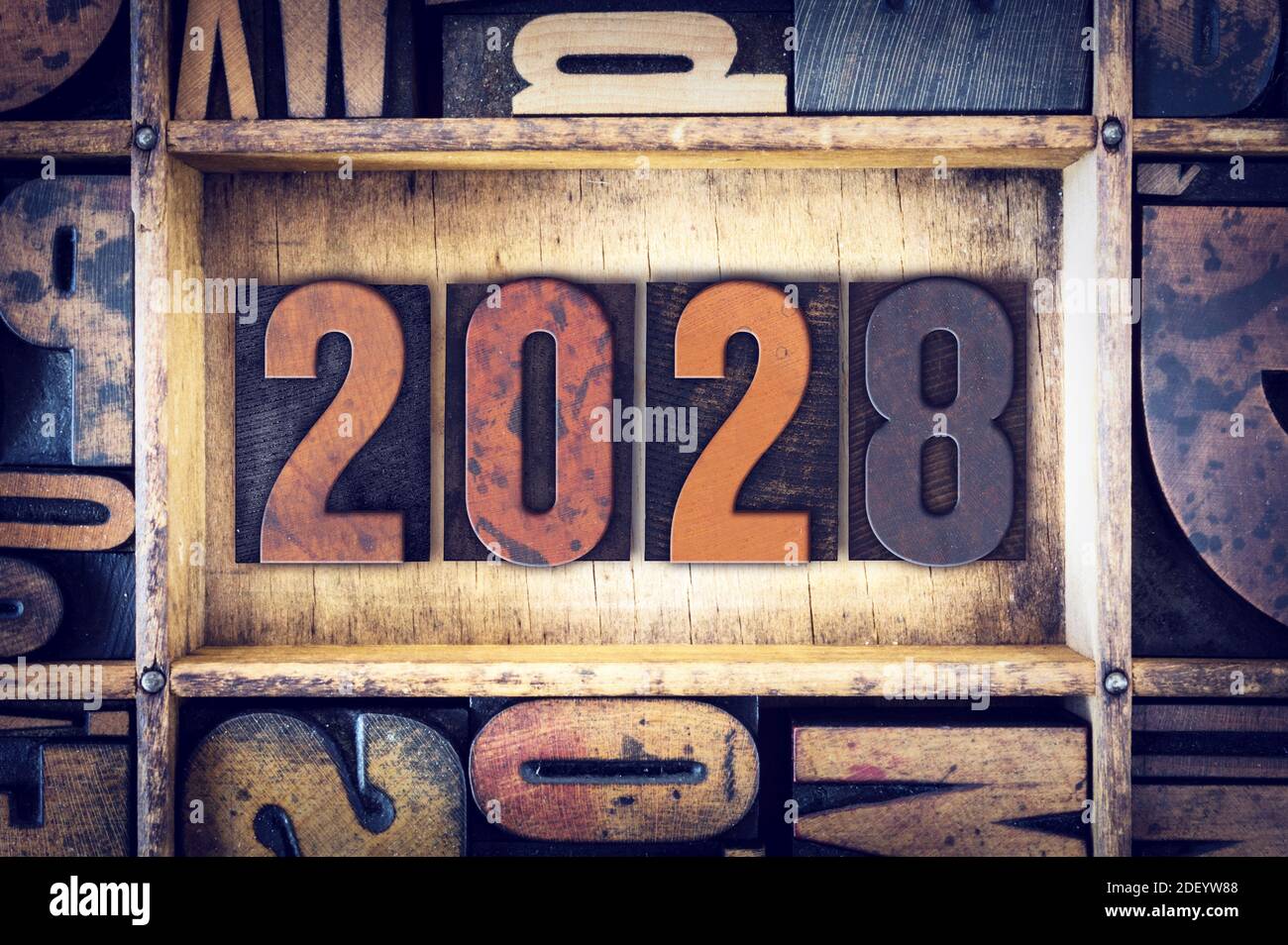 The year 2028 written in old vintage letterpress type. Stock Photo