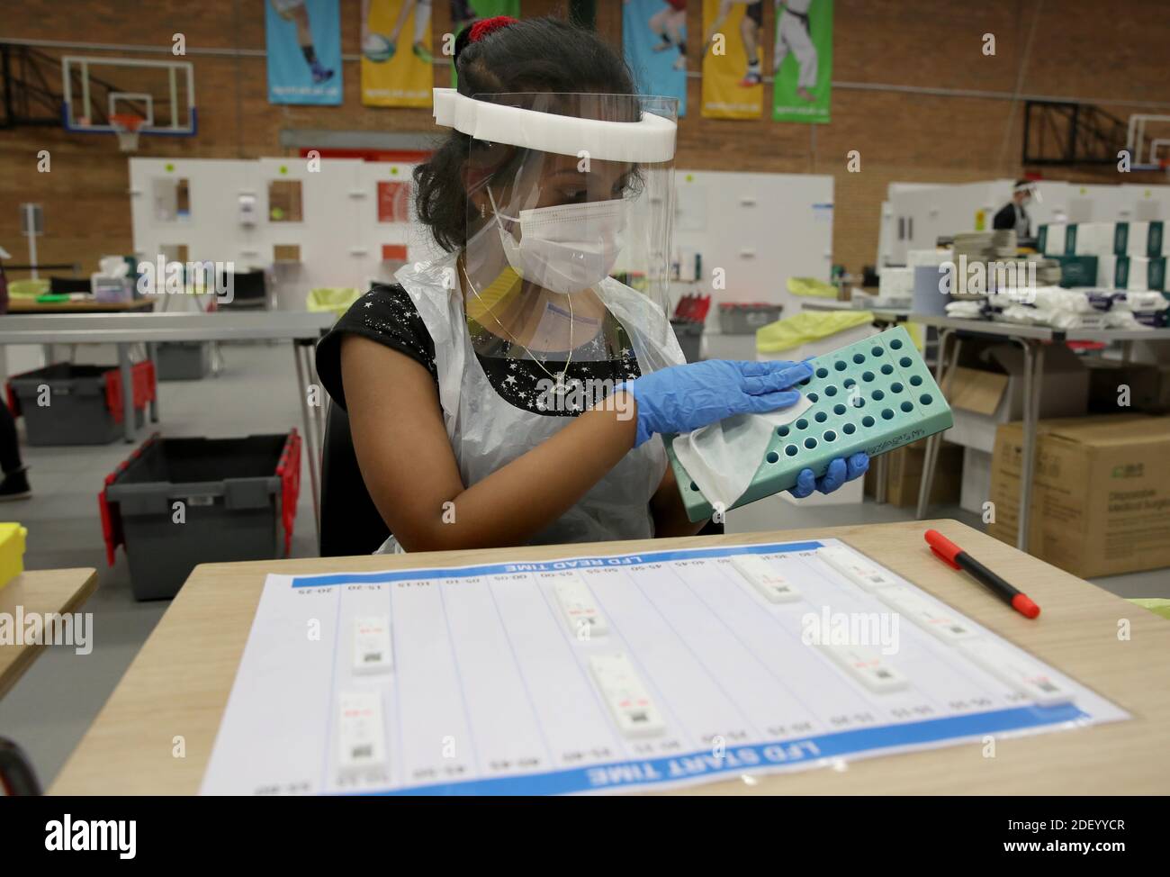 People clean equipment in between an asymptomatic test using lateral