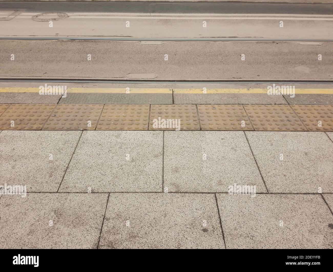 The pavement and yellow tram marks outdoors at daytime Stock Photo Alamy