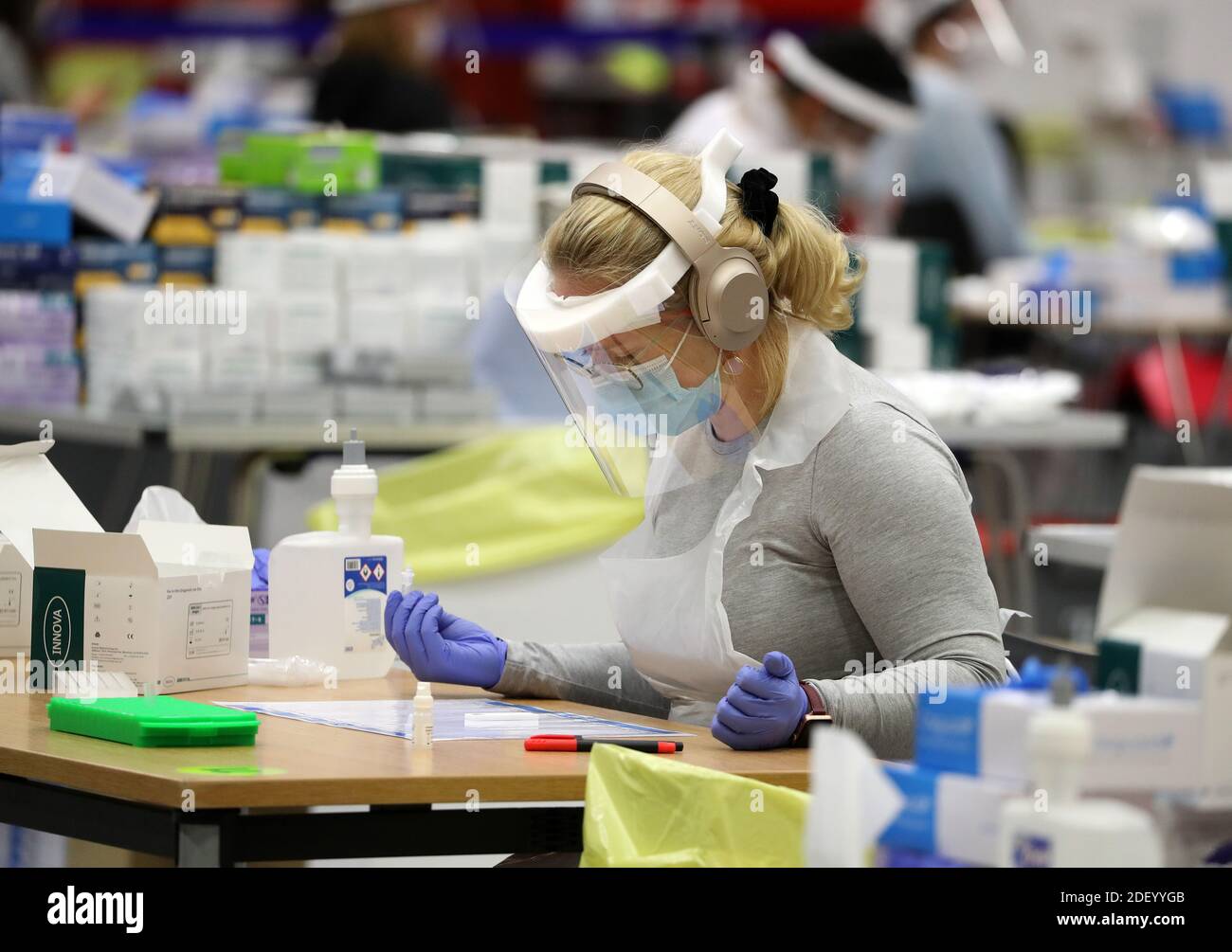 People carry out asymptomatic testing using lateral flow antigen at a