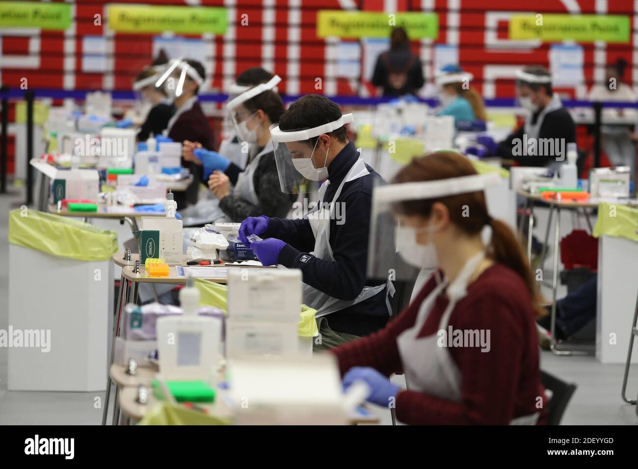 People carry out asymptomatic testing using lateral flow antigen at a