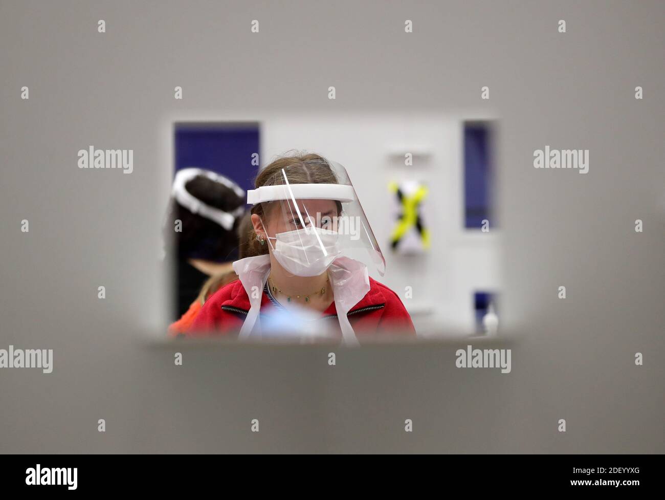 People carry out asymptomatic testing using lateral flow antigen at a