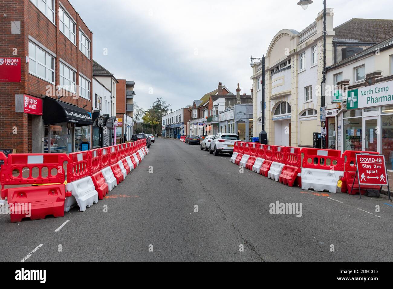 Temporary road alterations to allow social distancing for shoppers in UK town during the 2020 coronavirus covid-19 pandemic Stock Photo