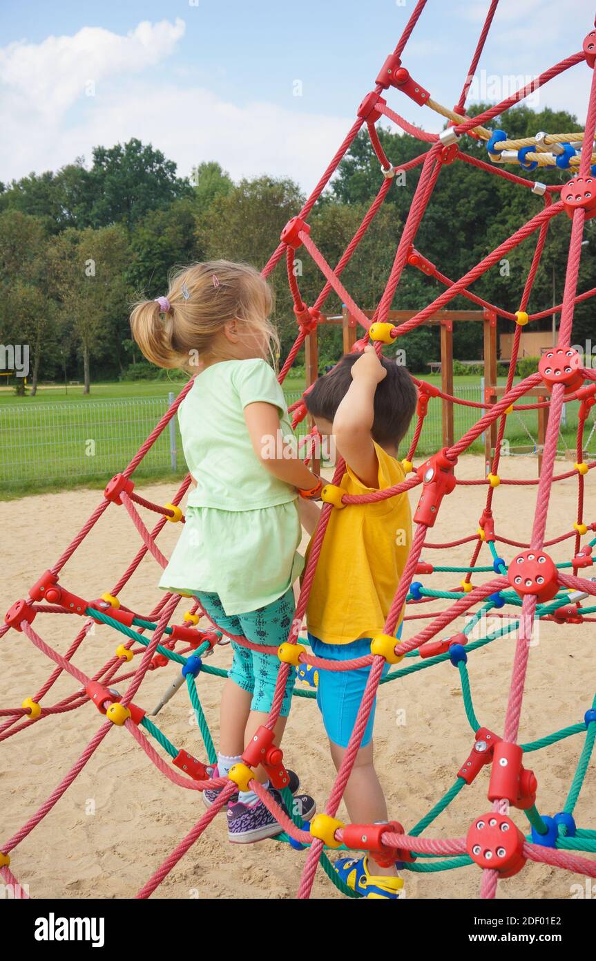 Little girl climbing ropes playground hi-res stock photography and images -  Page 2 - Alamy