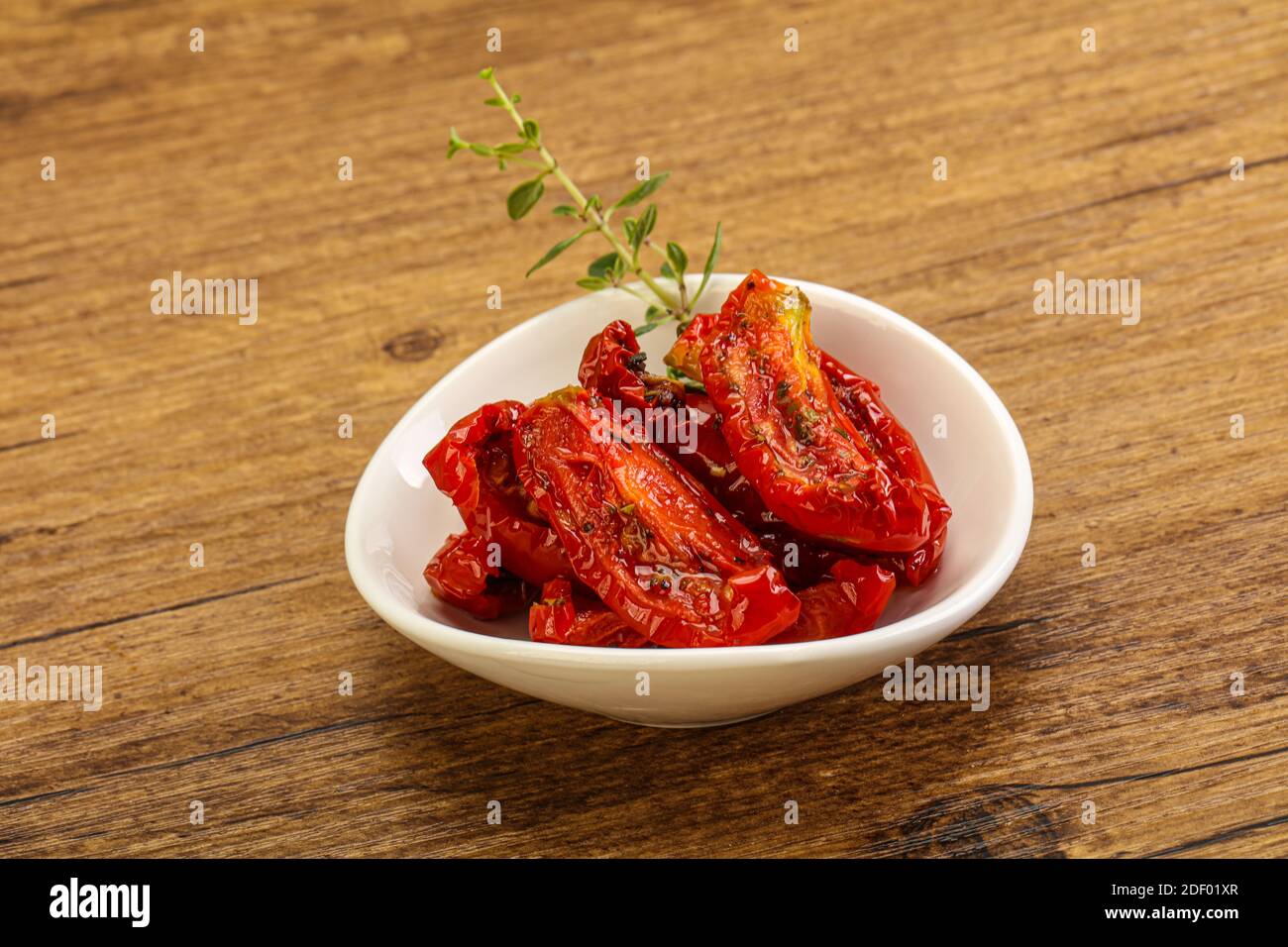 Sundried tomato in olive oil with herbs and spices Stock Photo Alamy