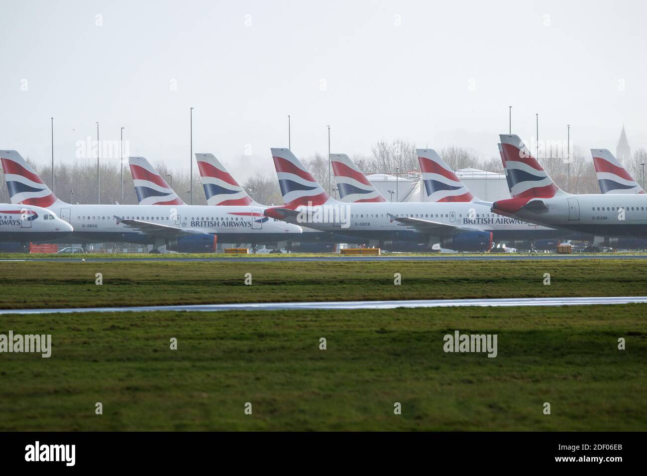 Glasgow, Scotland, UK. 2nd Dec, 2020. Pictured:British Airways airbus jets still stand grounded due to the coronavirus (COVID19) pandemic. Due to the uncertainty and a massive and unprecedented downturn in the global airline industry, British Airways (BA) have laid over a quarter of their staff. Glasgow Airport have now parked the grounded jets over to a smaller area of the tarmac as they used to occupy part of the airports second runway. Credit: Colin Fisher/Alamy Live News Stock Photo