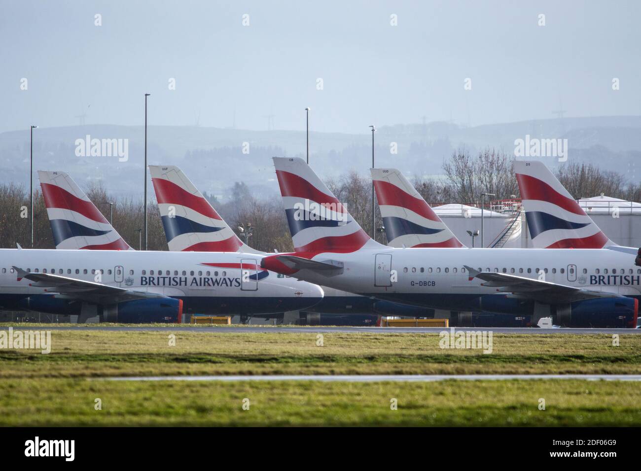 Glasgow, Scotland, UK. 2nd Dec, 2020. Pictured:British Airways airbus jets still stand grounded due to the coronavirus (COVID19) pandemic. Due to the uncertainty and a massive and unprecedented downturn in the global airline industry, British Airways (BA) have laid over a quarter of their staff. Glasgow Airport have now parked the grounded jets over to a smaller area of the tarmac as they used to occupy part of the airports second runway. Credit: Colin Fisher/Alamy Live News Stock Photo