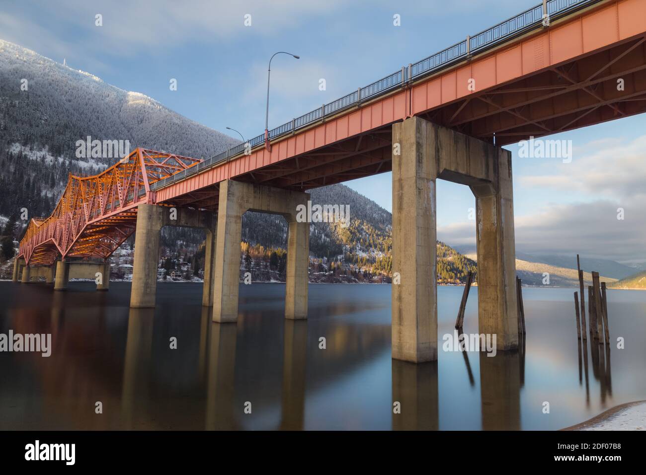 A beautiful wintery view of the Big Orange Bridge in  Nelson, B.C. on a sunny day. Stock Photo