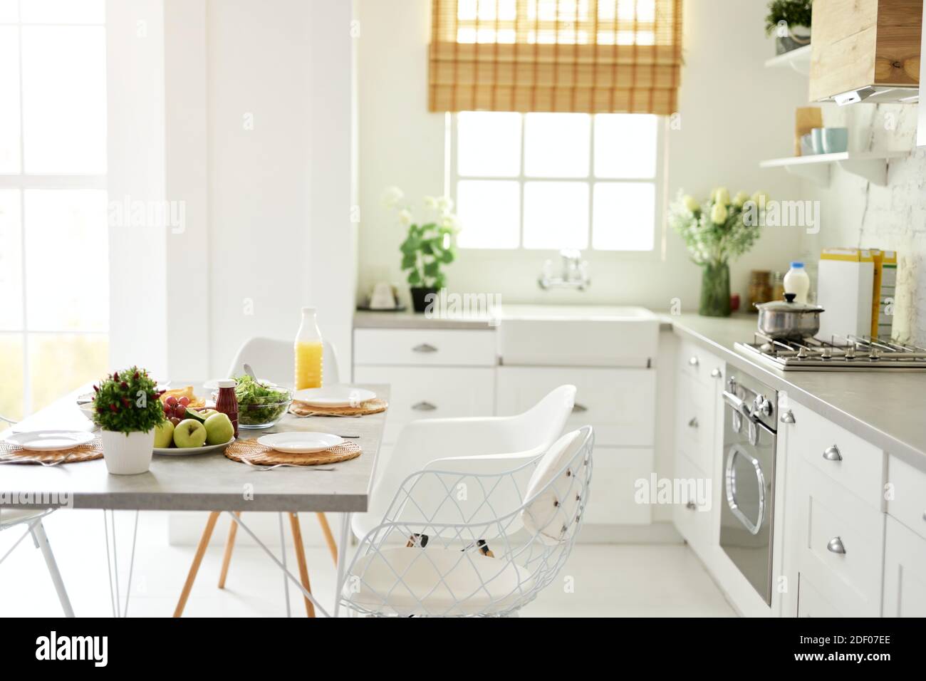 Modern bright white kitchen interior with wooden and white details ...