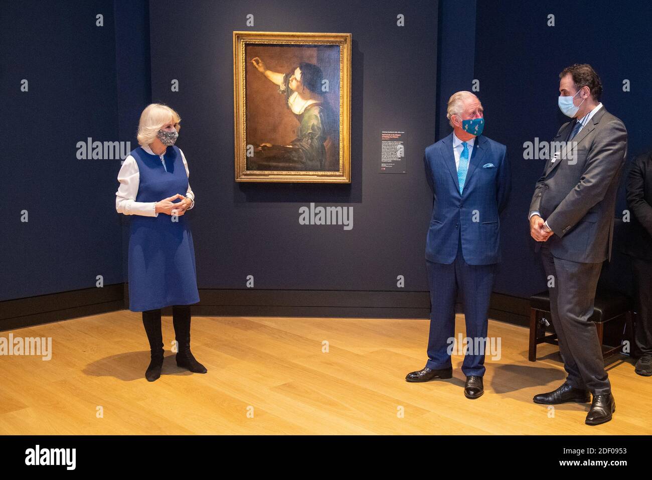 The Prince of Wales and Duchess of Cornwall and National Gallery Director Dr Gabriele Finaldi view 'Self Portrait as the Allegory of Painting (La Pittura)' by Artemisia Gentileschi during a visit to view the 'Artemisia' and the 'Titian: Love Desire Death' exhibitions at the National Gallery in London, on its first day of reopening following the second national coronavirus lockdown. Stock Photo