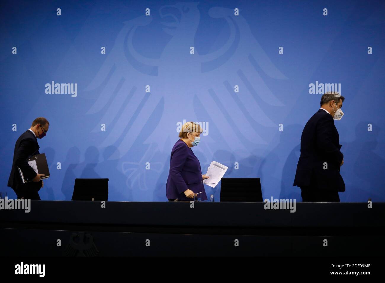 Berlin, Germany. 02nd Dec, 2020. German Chancellor Angela Merkel (M, CDU),  Michael Müller (SPD, l), Governing Mayor of Berlin, and Markus Söder (r,  CSU), Prime Minister of Bavaria, leave at the end