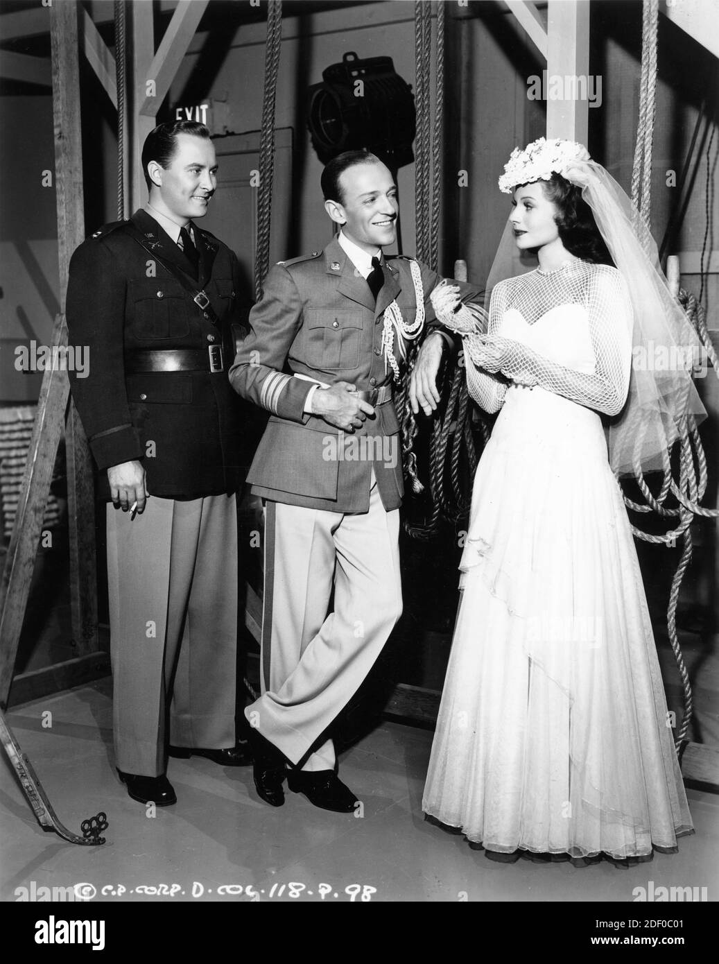 JOHN HUBBARD FRED ASTAIRE and RITA HAYWORTH on set candid during filming of YOU'LL NEVER GET RICH 1941 director SIDNEY LANFIELD gowns Robert Kalloch Columbia Pictures Stock Photo