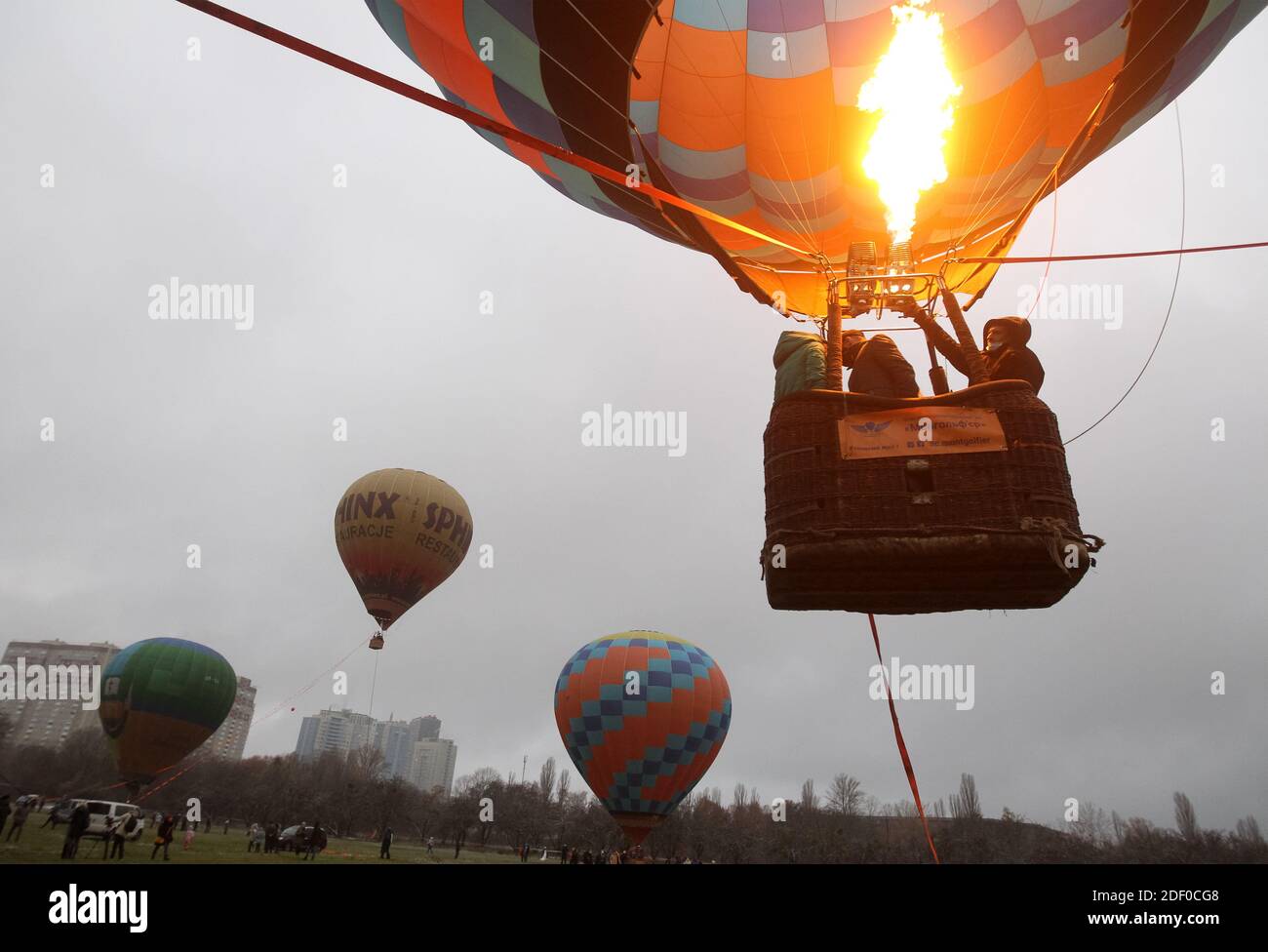 Hot air balloon with visitors ascending in the sky during the festival.The  Hot Air Balloon Festival is organized by the Hot Air Balloon Society and  the Ukrainian Aeronautical Society, a visitor can