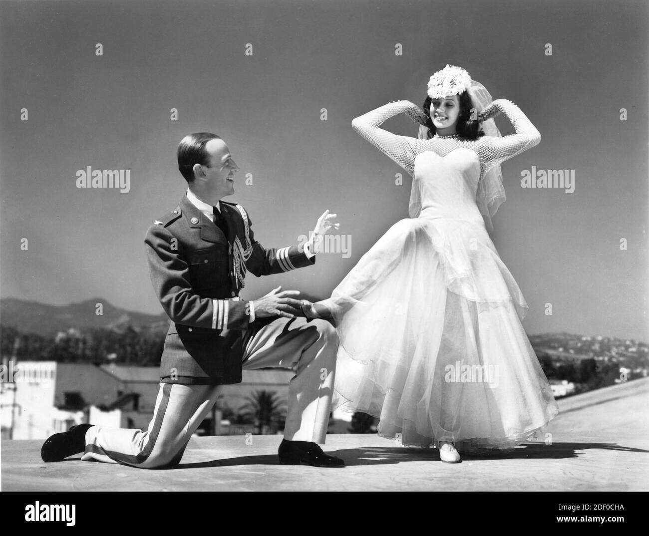 FRED ASTAIRE and RITA HAYWORTH candid publicity pose for YOU'LL NEVER GET RICH 1941 director SIDNEY LANFIELD gowns Robert Kalloch Columbia Pictures Stock Photo