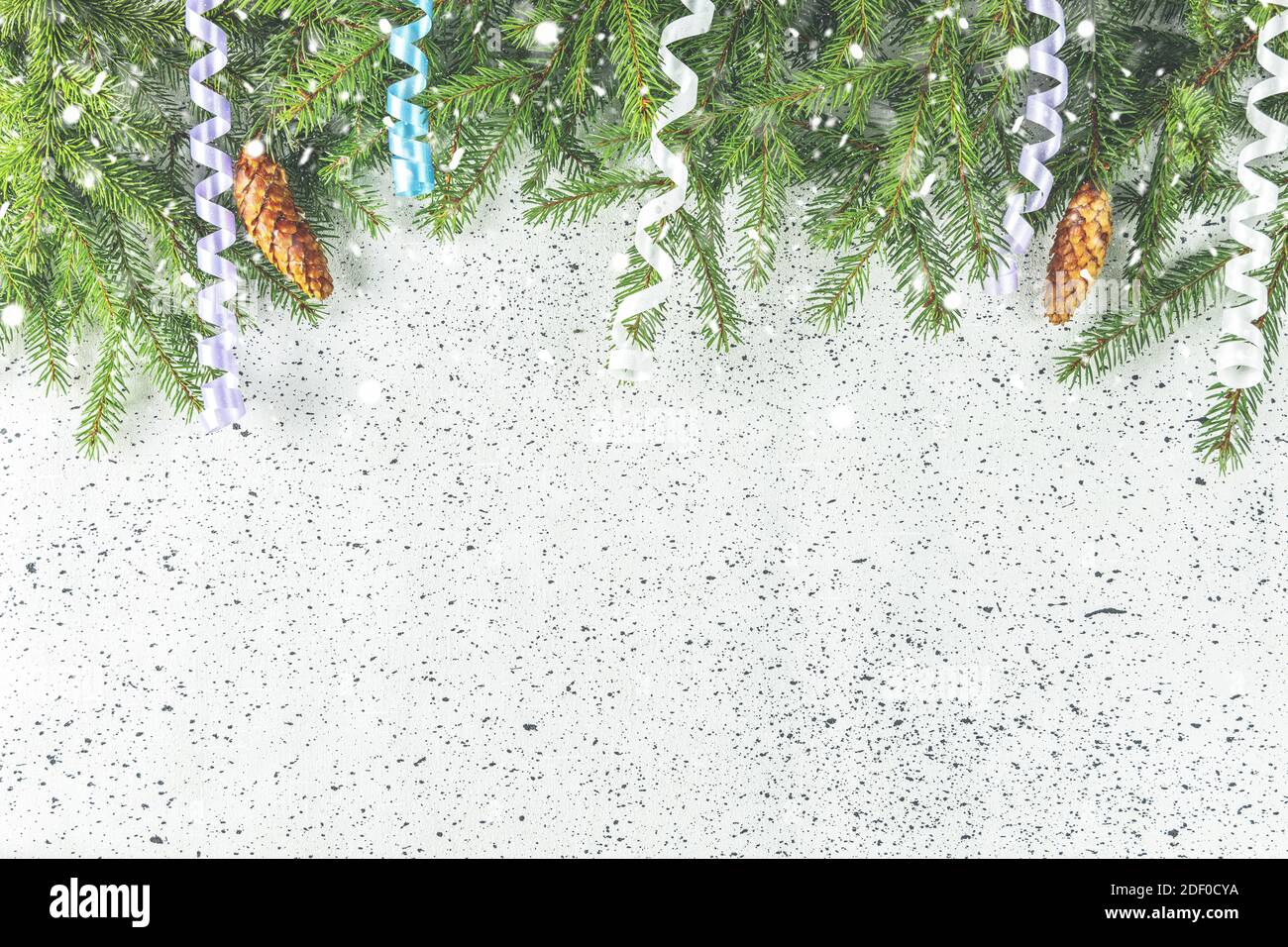 Christmas or New Year background with green fir branches and cones ...