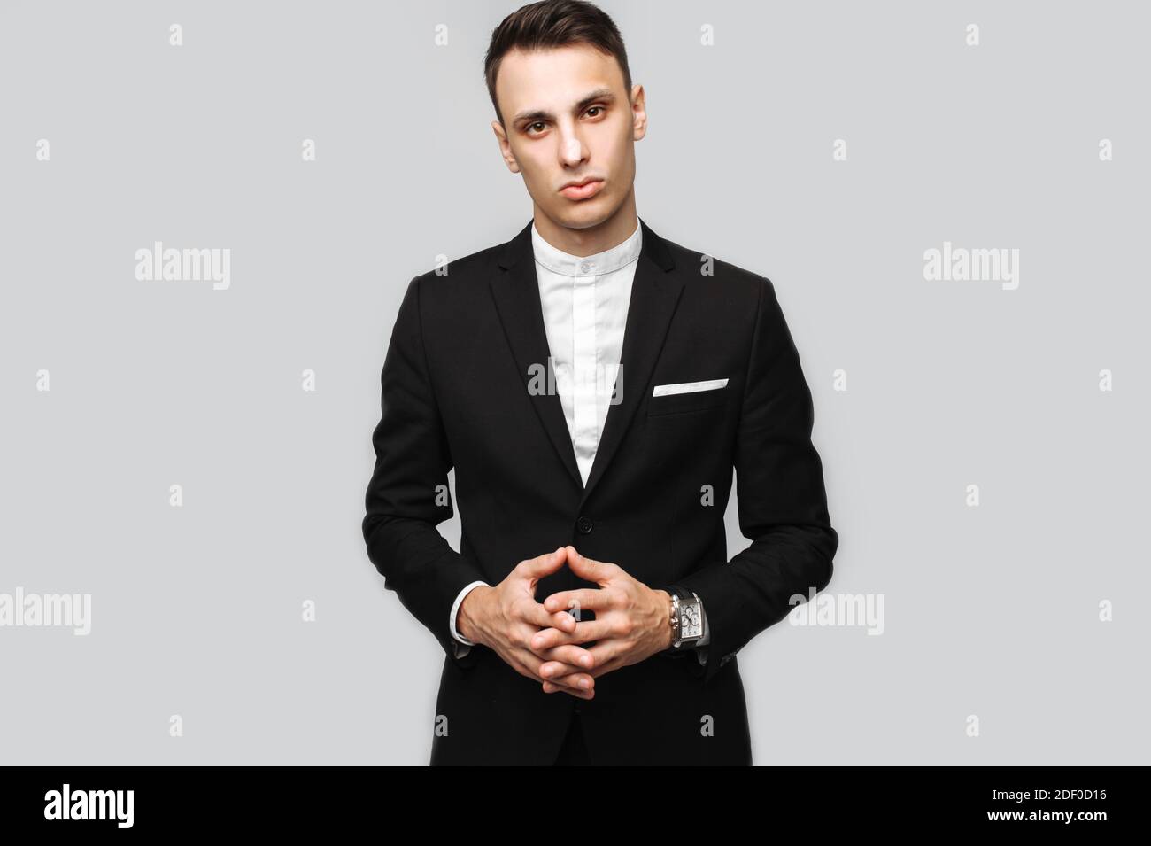 Portrait of a handsome young business man, male, in a classic black ...