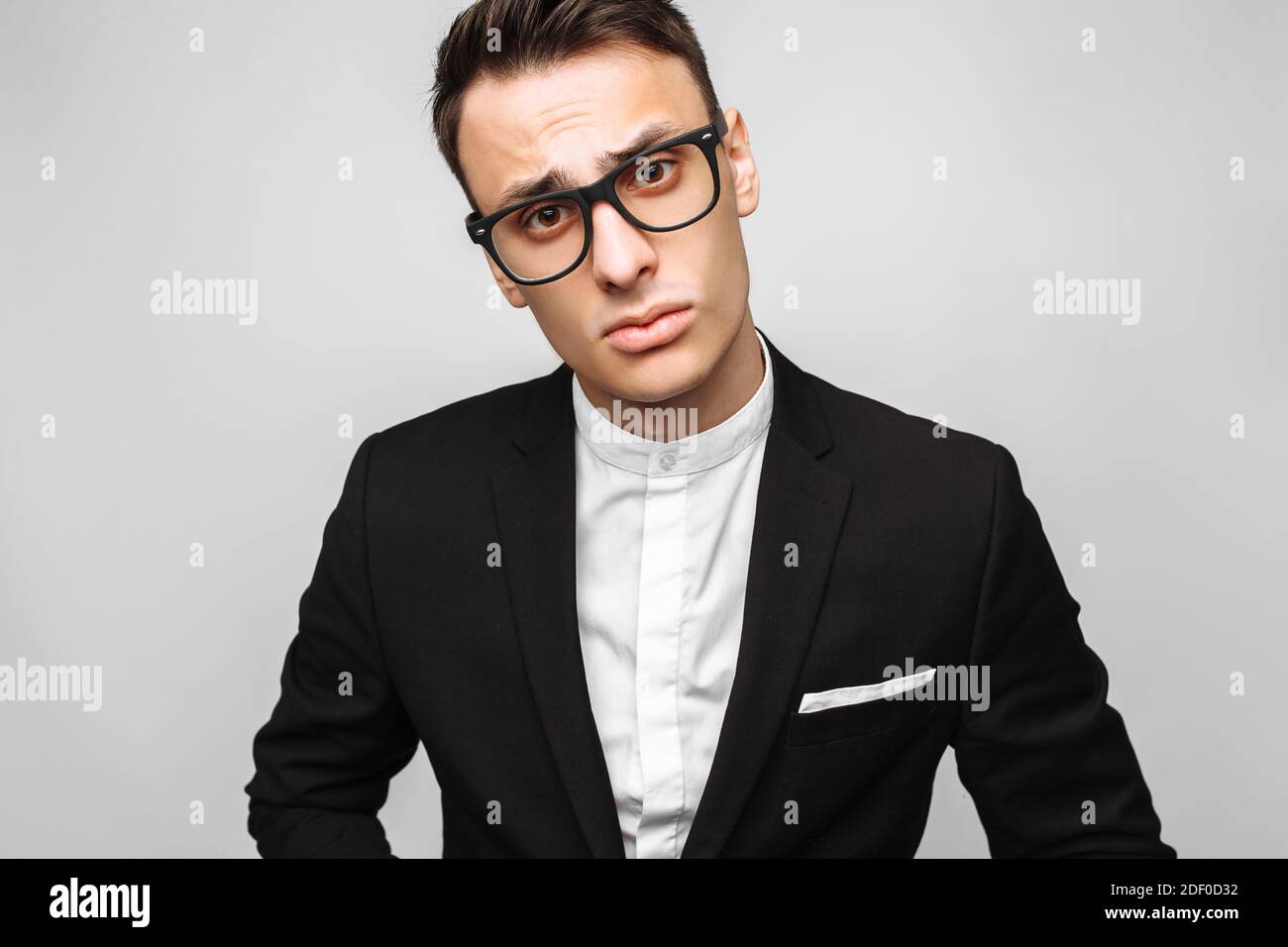 Portrait of a handsome young business man, male, in a classic black ...