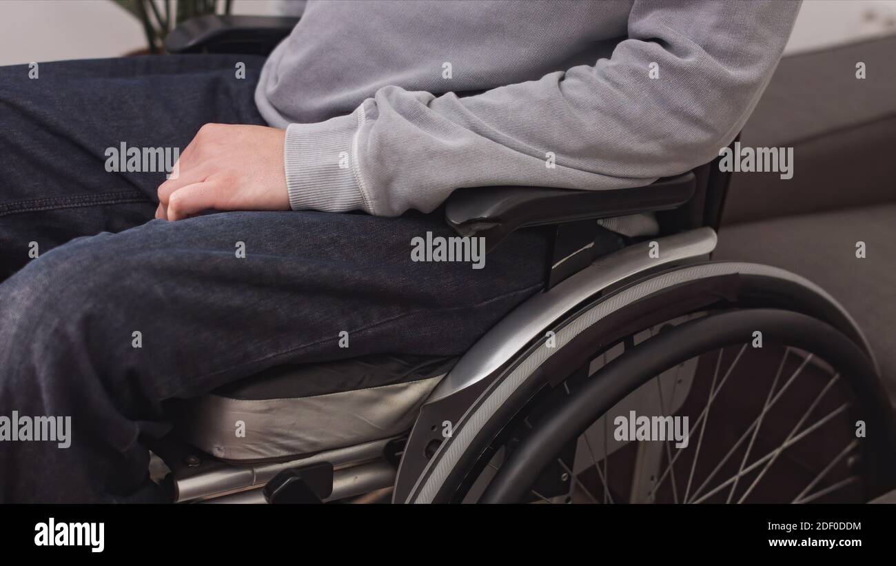 Sick man in a wheelchair hi-res stock photography and images - Alamy