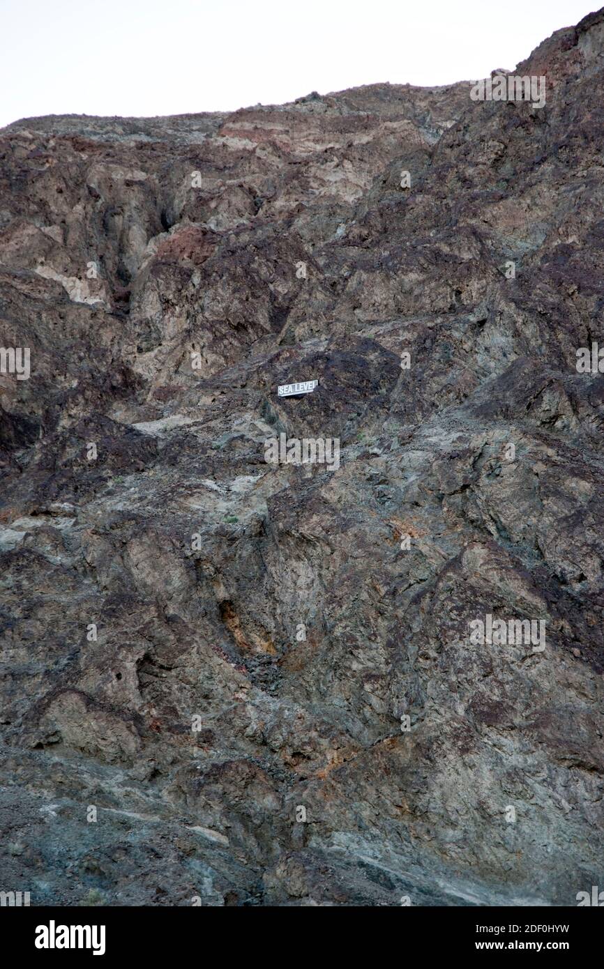 A marker denotes sea level, 282 feet up the canyon wall at Badwater