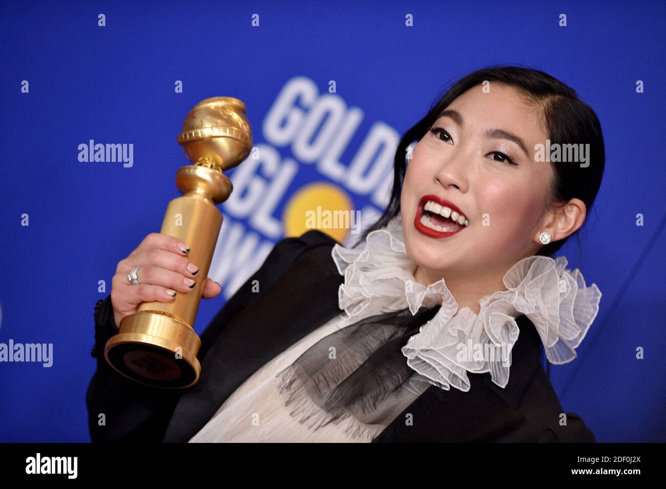 Awkwafina poses in the press room of the 77th Annual Golden Globes ...