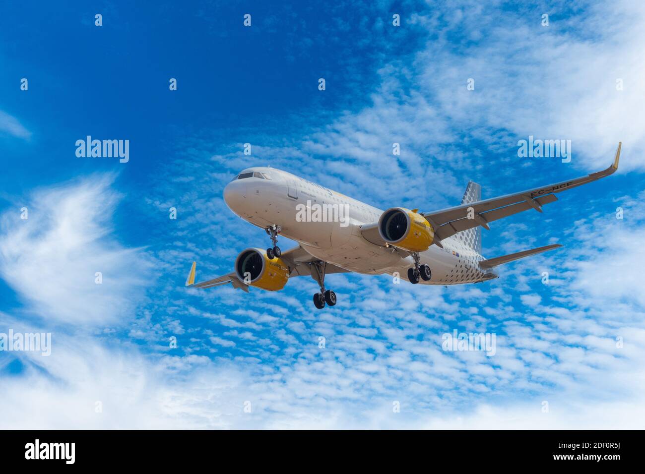 Vueling Airbus A320 with wheels down approaching airport runway on landing at Gran Canaria airport Stock Photo