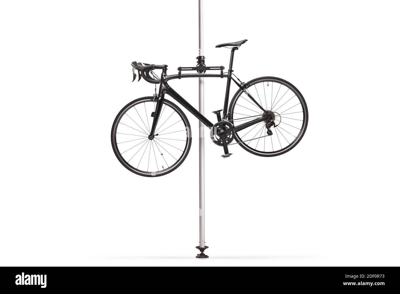 Black bicycle hanging on a stand isolated on white background Stock