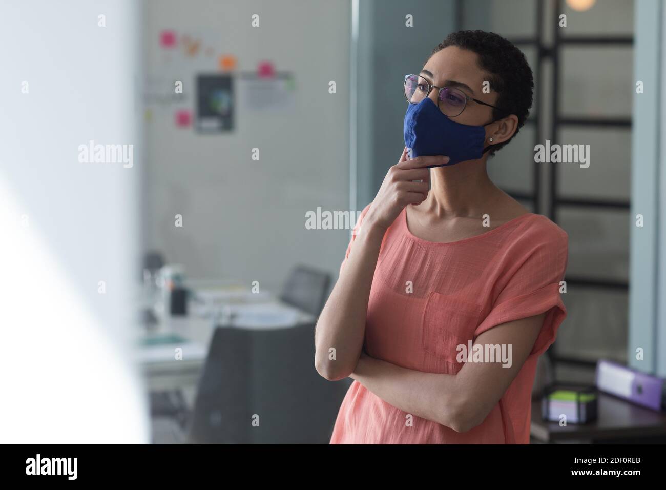 Mixed race woman wearing mask hi-res stock photography and images - Alamy