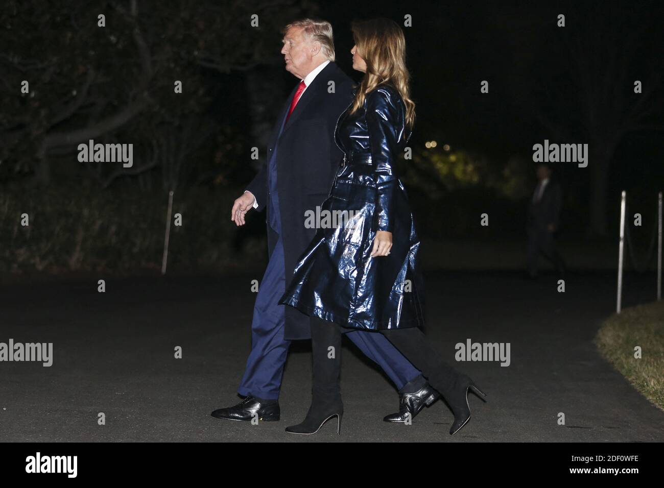 President Donald Trump and first lady Melania Trump walk on the South Lawn  as they arrive to the White House on January 14, 2020 in Washington, DC.  President Trump and first lady