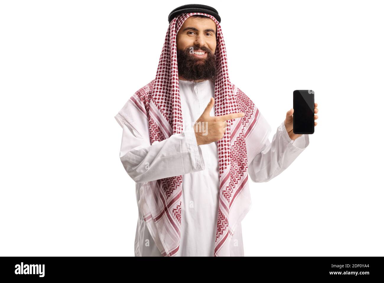 Arab man holding a smartphone and pointing isolated on white background Stock Photo