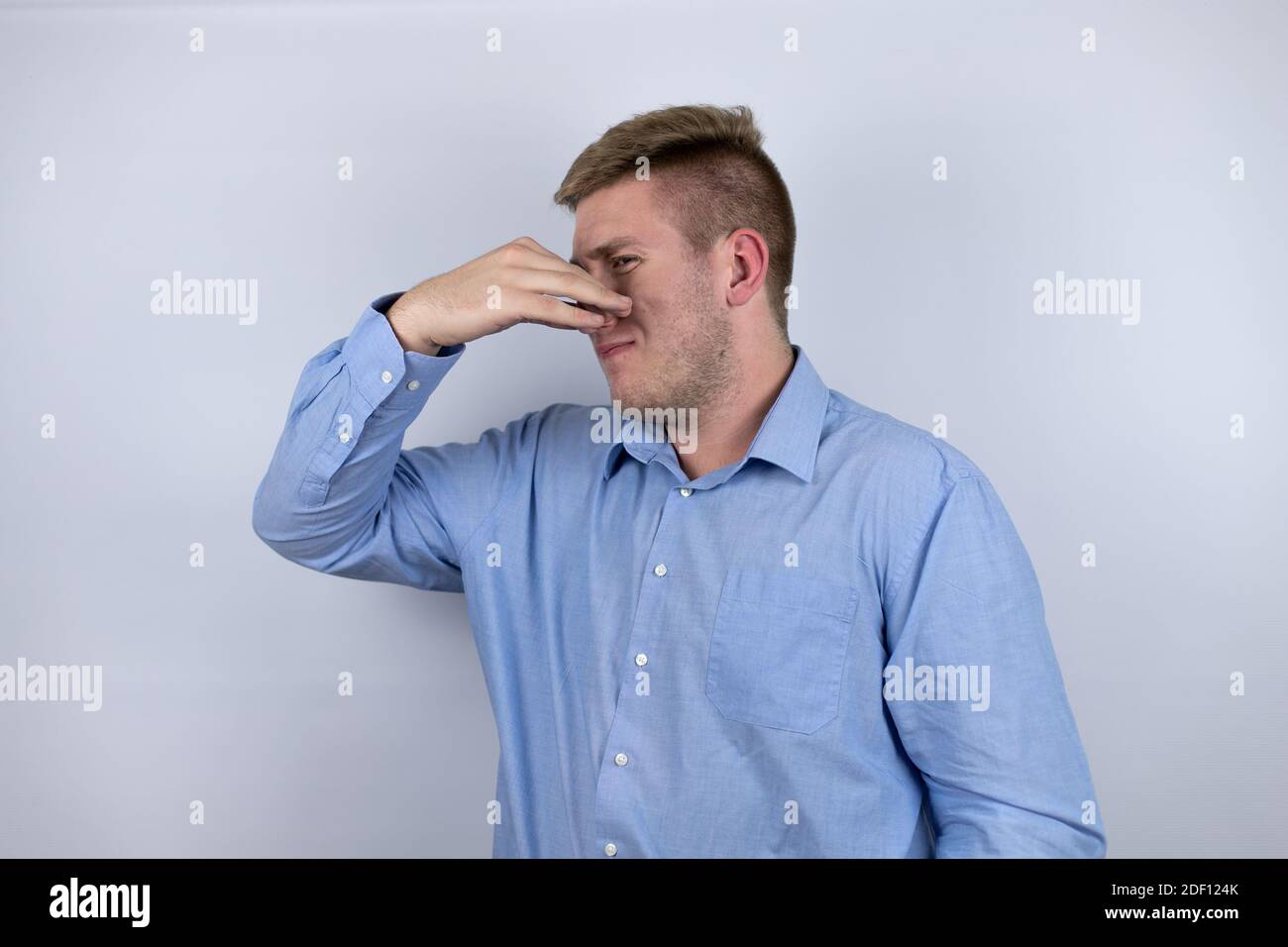 Business young man wearing a casual shirt over white background ...