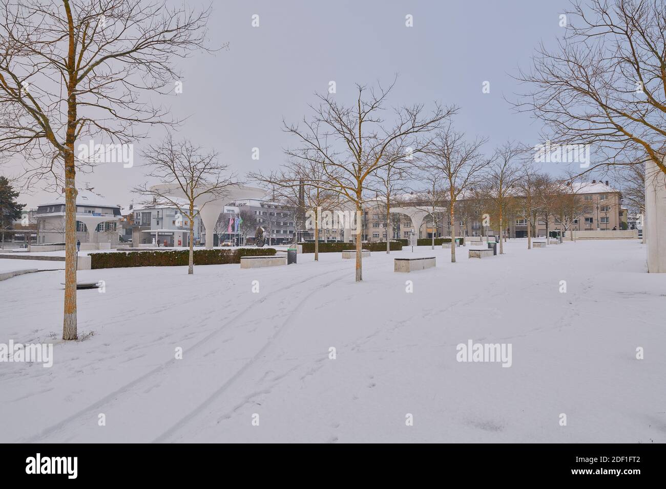 Darmstadt, Germany, 01 Dec 2020: Georg Büchner Platz, covered by snow in a cloudy morning Stock Photo