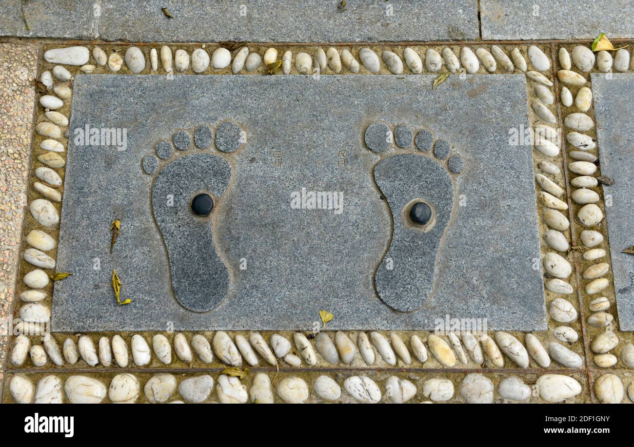 An unusual foot massage paving slab in Wanshou park southern central Beijing, China Stock Photo