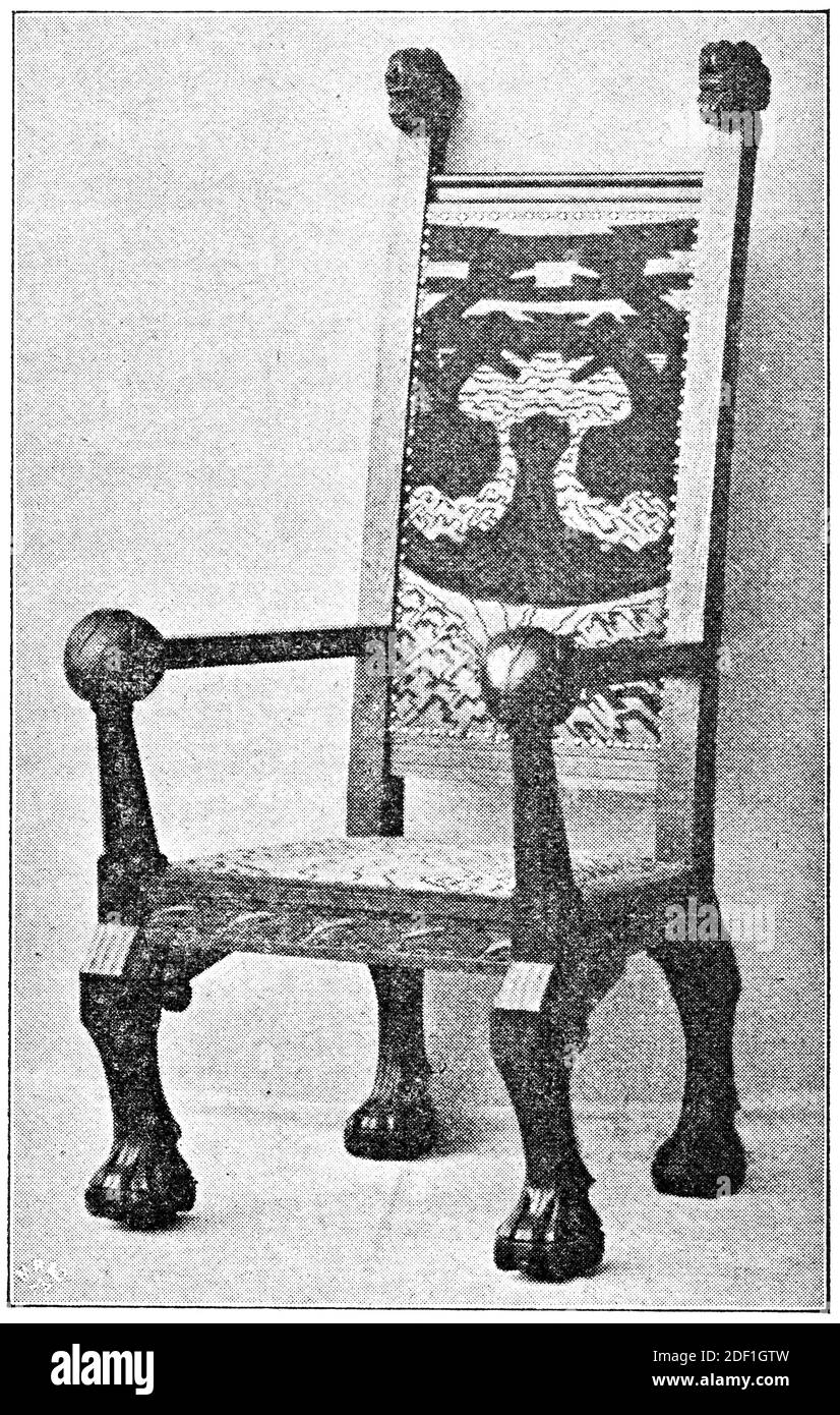 A beautiful oak armchair with a high back. Illustration of the 19th century. Germany. White background. Stock Photo