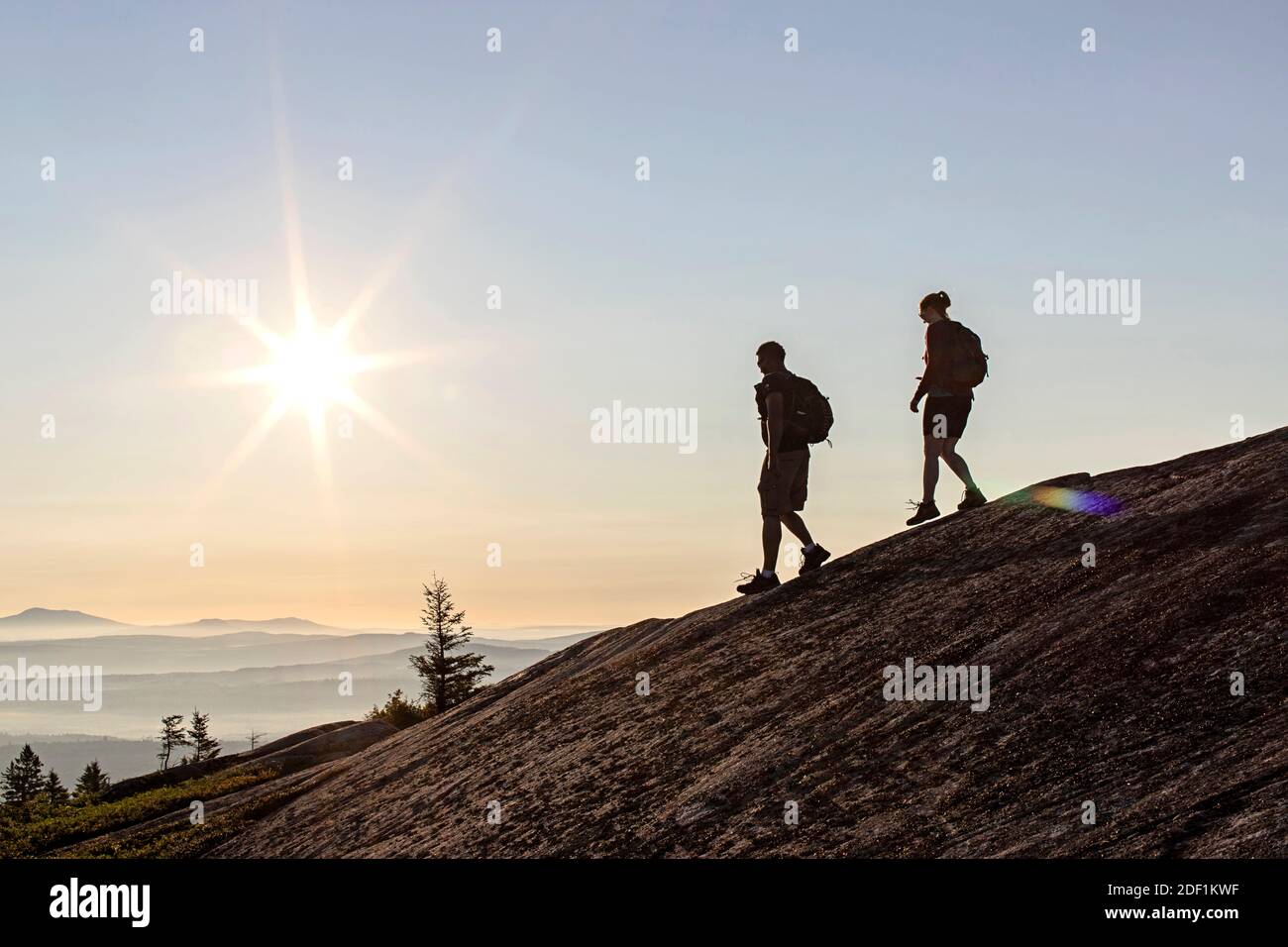Silhouette hikers standing on mountain hi-res stock photography and ...