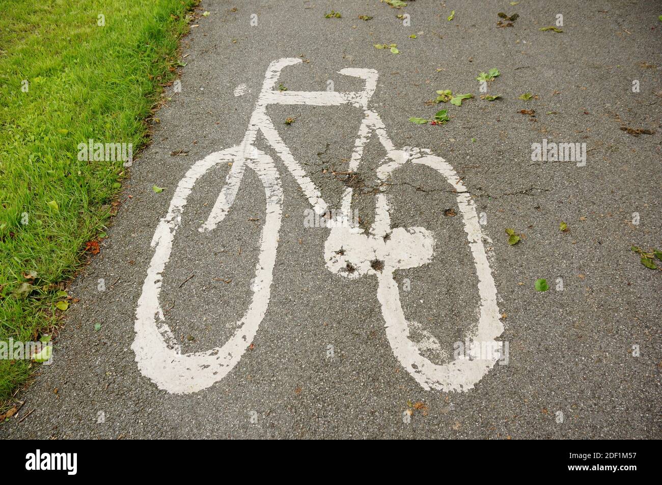 A white-painted bicycle symbol on asphalt indicated road for bicycles ...