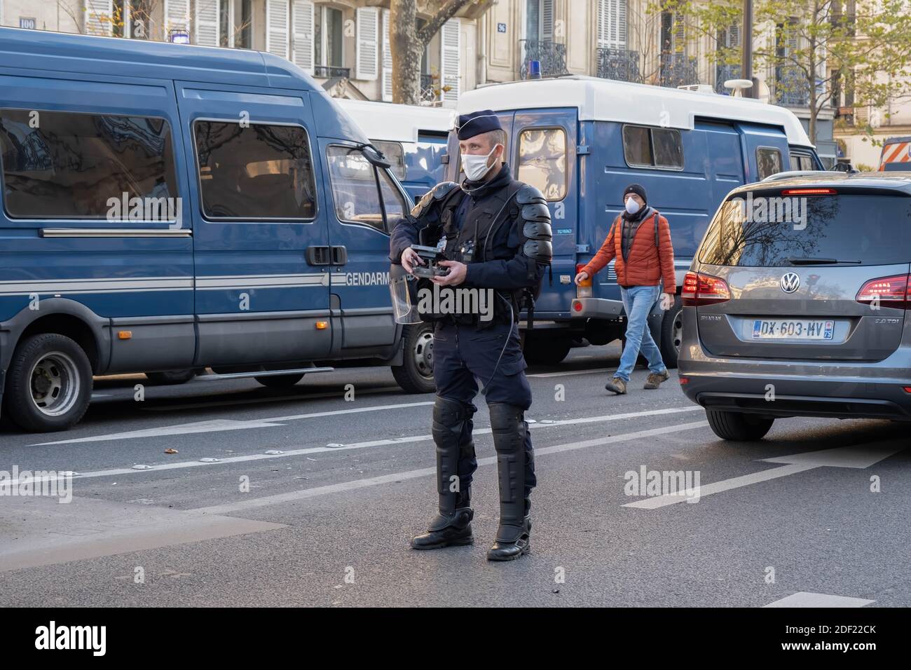Paris, France - November 28th 2020 : at the march against the global security law, police officers operating a drone Stock Photo