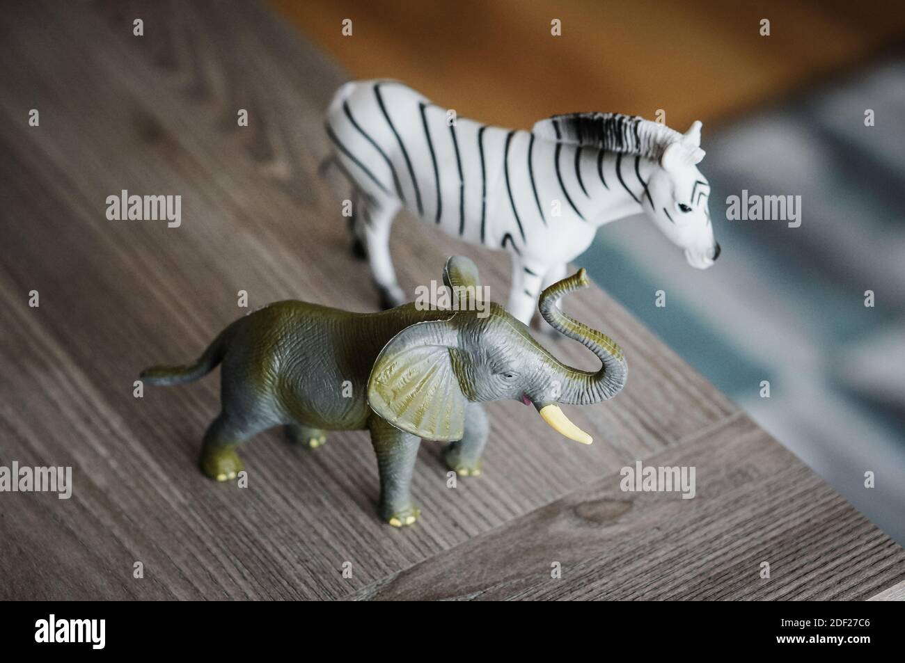 A closeup shot of plastic elephant and zebra toys Stock Photo