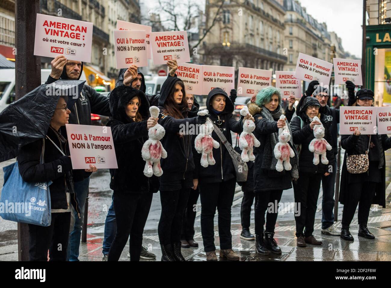 Activists from the PETA and One Voice associations are standing in front of  one of the American Vintage brand's shops, brandishing "bloody rabbits" and  signs to denounce the mistreatment suffered by angoras