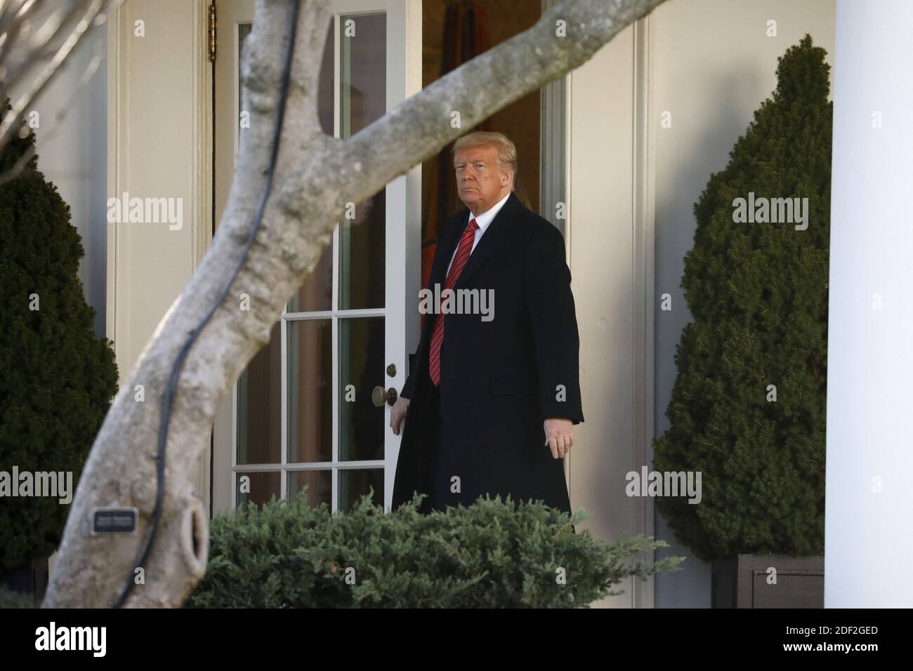 U.S. President Donald Trump walks out from the Oval Office of the White ...