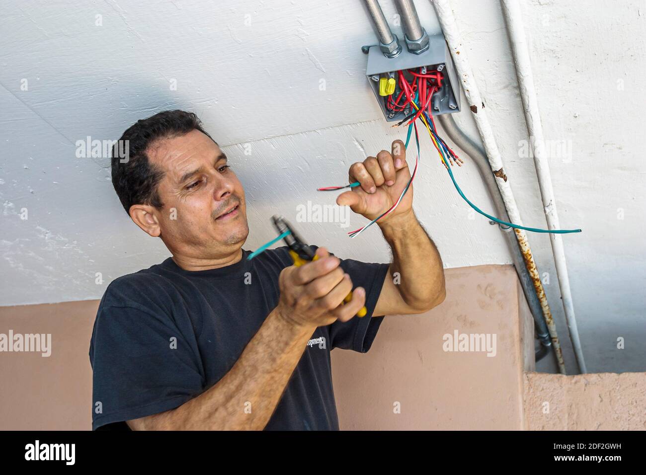 Miami Beach Florida,Hispanic man male,installing installs condominium