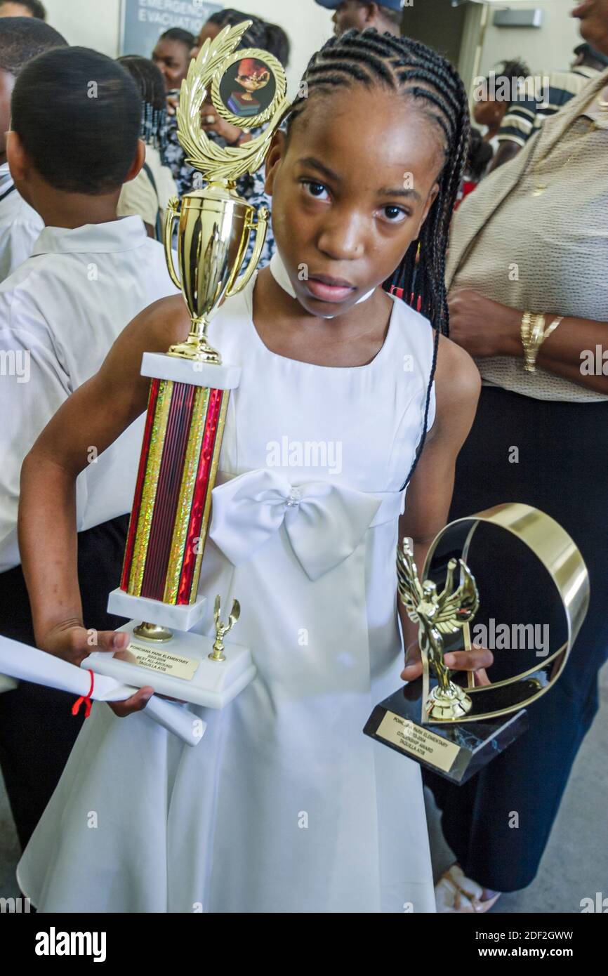 Miami Florida,Poinciana Park Elementary School,5th grade graduation exercise event ceremony,student Black African Haitian immigrant immigrants girl aw Stock Photo