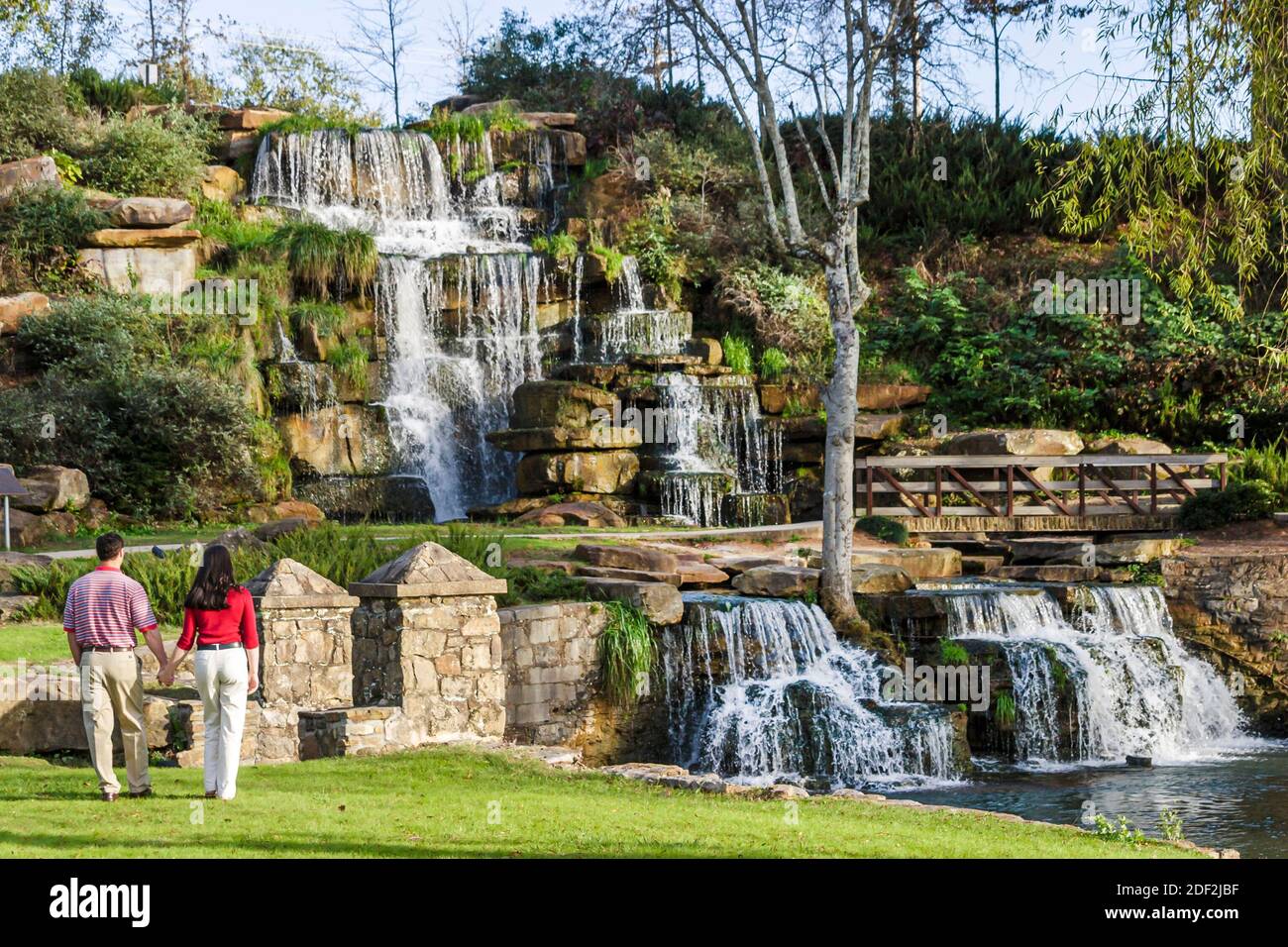 Alabama Tuscumbia Spring Creek Park Cold Water Falls,world's largest manmade natural stone waterfall couple,man woman, Stock Photo
