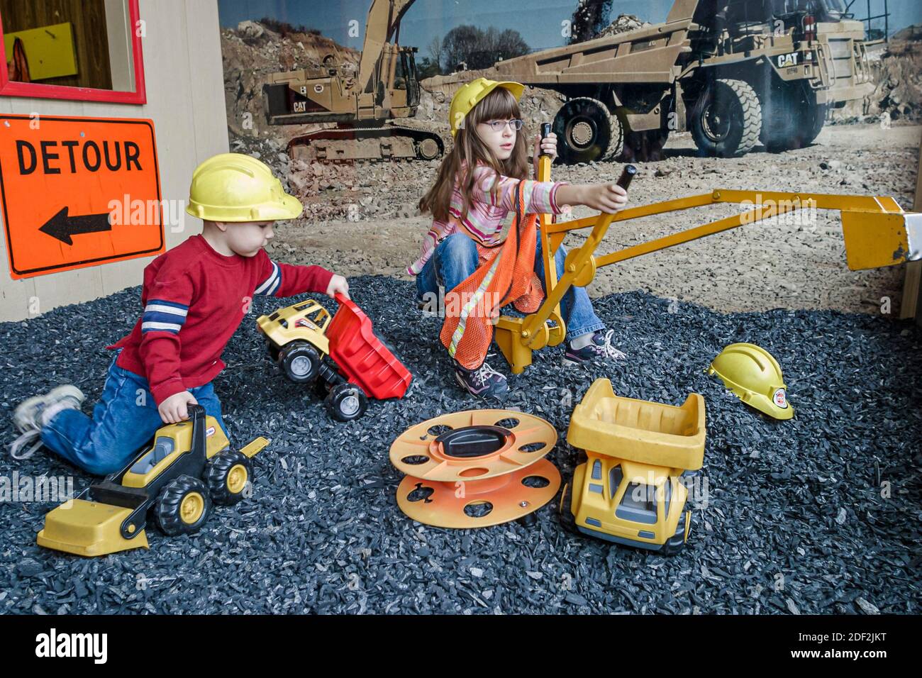 Alabama Gadsden Imagination Place,children's interactive hands on museum,mining boy girl pretending play playing, Stock Photo