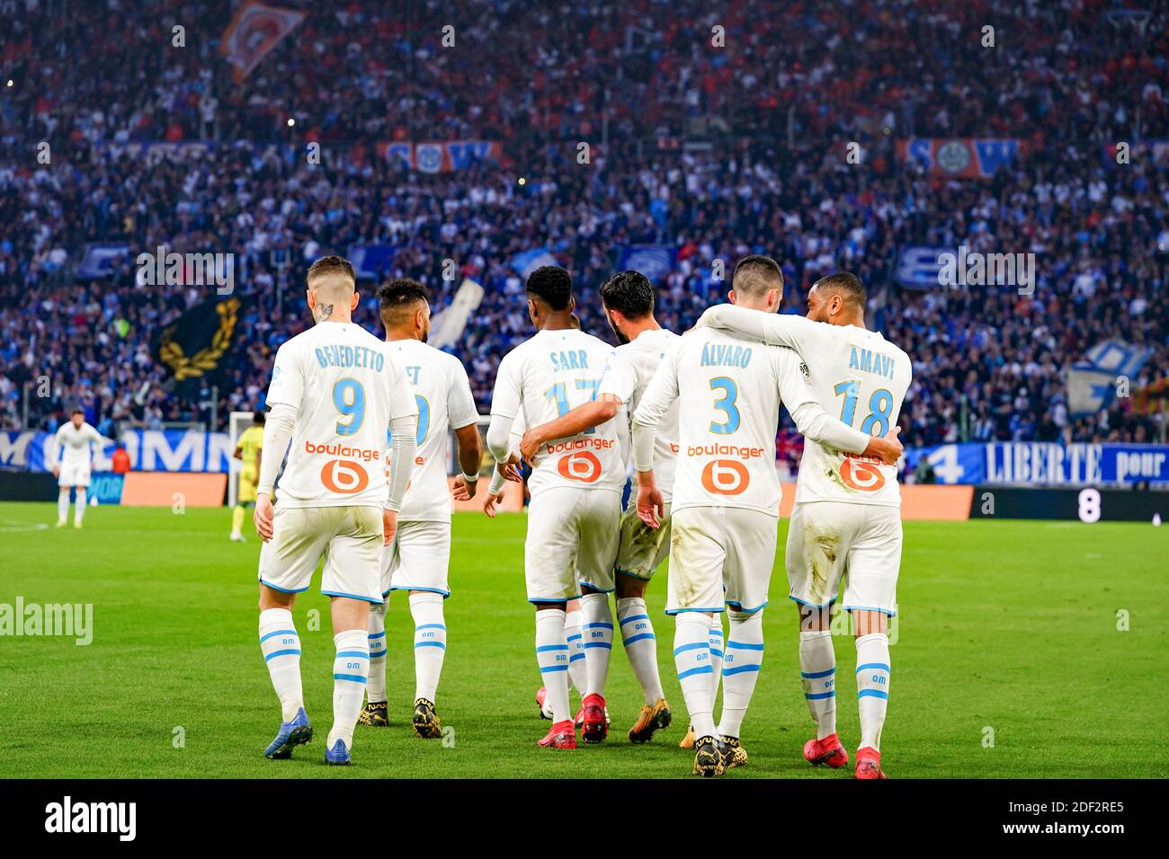OM players celebrate the Morgan Sanson goal during the French Ligue 1  football match Olympique de Marseille v FC Nantes at the Orange Velodrome,  in Marseille, France on February 22, 2020. Photo
